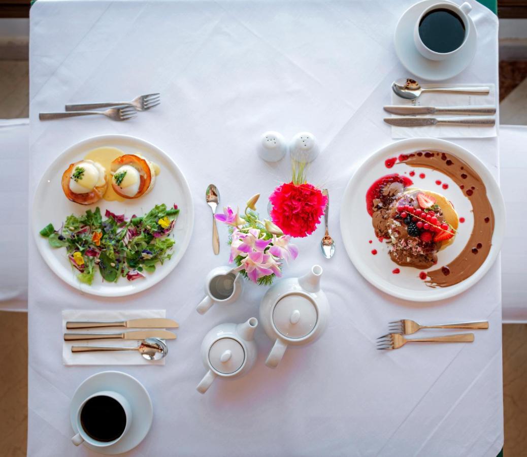 Mitsis Grand Hotel Rhodes City Exterior foto A table set for afternoon tea